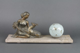 An Art Deco spelter and marble table lamp in the form of a kneeling lady with faun, raised on a rectangular marble base and with glass globular shade 18" 