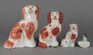 3 Victorian Staffordshire ochre spaniels 3", 5" and 6", a ditto pie lifter in the form of a girl 1 1/4" 