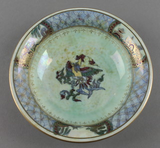 A Wedgwood lustreware shallow bowl, the turquoise ground with stylised bird beneath a rim of pagodas and gardens 6"