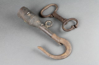 A 19th Century iron animal nose clamp together with an iron tether?