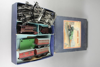 A Hornby no.501 O gauge passenger train set comprising clockwork locomotive (f), tender, 3 carriages, various items of rail, boxed 