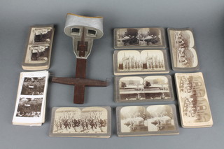 An Underwood & Underwood stereoscopic viewer together with an Underwood & Underwood card - The Mortal Body of His Holiness The Late Supreme Pontiff Leo XIII together with 49 Underwood & Underwood stereoscopic cards and other cards 