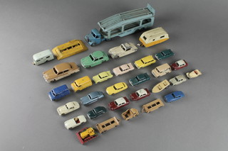 A Dinky car transporter, a pair of Hillman Imp ditto Studebaker, ditto Jaguar and caravan no.190 (in poor condition) together with a Lesney car transporter, caravan, bulldozer and 19 various vehicles 