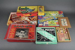 A set of building blocks, metal puzzle set, Ludo game, David Berglas conjuring trick set, boxed and other various board games