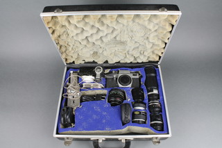 A Praktica LBT camera, a Soligor 1:4.5 F=200mm lens no.280816, an Meyer-Optik Gorrlitz Domiplan 2.8/50 lens, an Soligor wide 1:3.5 F=35mm no.34699 lens, a Vivitar 24mm 1:2.8 auto wide - angle lens, no. 37610472 58mm lens, Pentax Auto x 2 converter, a Pentax Auto x 3 converter and other equipment contained in a gadget box 
