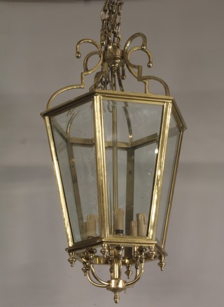 A Georgian style 6 sided hall lantern with glass panels and hung an electrolier to the centre 32"h x 17"w 