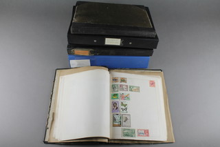 2 black albums of used commonwealth stamps, 3 loose leaf albums of world stamps and 2 other stamp albums   
