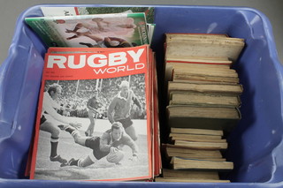 A box of various Rugby programmes