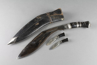 A Kukri with 12" blade, 2 skinning knives and scabbard