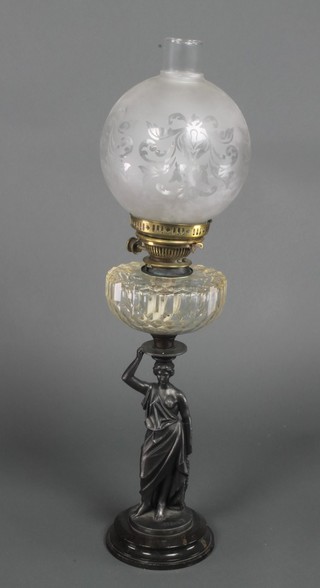 A Victorian spelter and glass oil lamp in the form of a classical lady supporting a clear glass oil lamp reservoir 28" 
