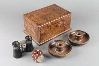An Art Deco cedar and figured burr walnut humidor with hinged lid, the base fitted a secret drawer 4 1/2"h x 8 1/2"w x 6 1/2"d together with a pair of turned wooden stub candlesticks 4", a Rolex thermometer contained in a plastic dice shaped case 1 1/2" and a pair of opera glasses  