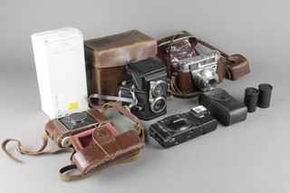 A Kodak Retina 2 camera and other cameras etc