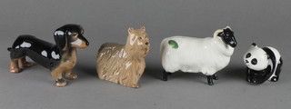 A Sylvac figure of a standing Dachshund 6 1/4", a Beswick ram 4 1/2", a ditto Yorkshire Terrier 4" and a standing panda 3" 
