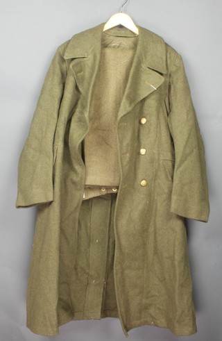A Second World War General Service Corps issue dismounted great coat, size 8, dated 1940 and a pair of battle dress trousers 1940 patent size 8