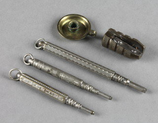 A Gesetzl GeschÃ¼tzt pencil sharpener, 3 propelling pencils and a miniature brass chamberstick 1" 