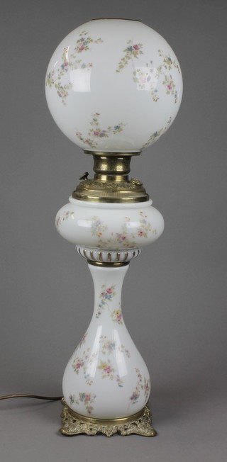 A Victorian floral patterned opaque glass and brass oil lamp converted to an electric table lamp complete with shade 23"  