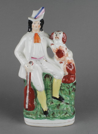 A Victorian Staffordshire figure of a musician with spaniel 13" 