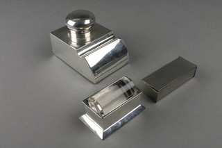 A silver desk top inkwell stamp holder together with a silver and glass stamp moistener and a plated stamp box 