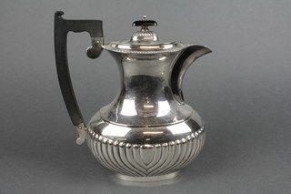 A silver demi-fluted coffee pot with ebonised handles, Sheffield 1964, approx gross 704 grams