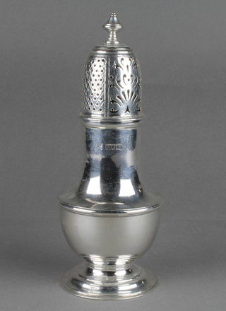 A Queen Anne style silver shaker of plain form 8 3/4" 354 grams