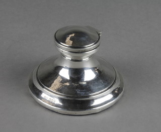 A silver capstan inkwell with ceramic liner, London 1928 