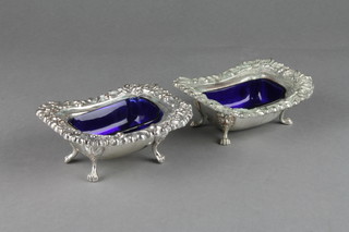 A pair of Sheffield plate rounded rectangular table salts and liners