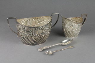 A Victorian repousse silver 2 handled sugar bowl and cream jug, London 1897, 440 grams and 2 other items