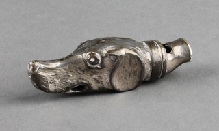 A mid Victorian novelty repousse silver whistle in the form of a hounds head, Birmingham 1860 1 1/2" 