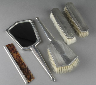 A silver engine turned 5 piece brush set