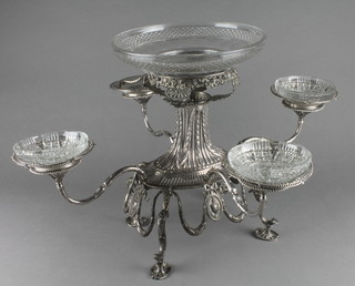 A Continental repousse white metal 5 section epergne with 4 detachable pierced dishes, the body with classical decoration with floral swags and festoons with urn cartouches on scroll feet 23", with later glass dishes