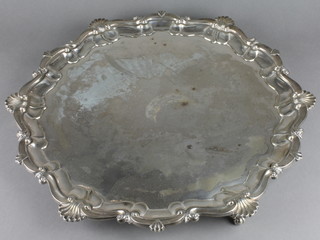 A late Victorian silver plated salver with Chippendale shell rim on scroll feet 14" 