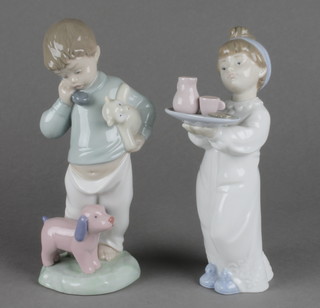 2 Nao figures a boy with toy dog 7", a girl with a plate of food 7" 