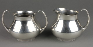 A stylish Mappin & Webb silver plated milk jug and sugar bowl 