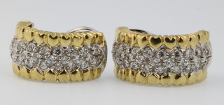 A pair of 18ct gold gem set half hoop earrings