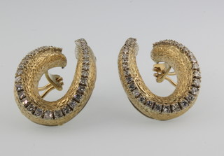 A pair of 18ct gold diamond set whorl ear clips 22 grams