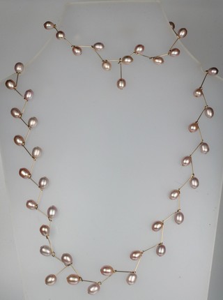 A 14ct gold cultured pearl bracelet and necklace