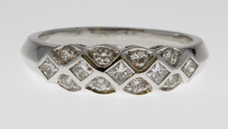 A 14ct white gold fancy diamond set ring, size M