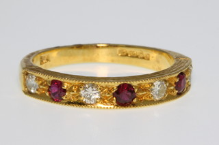 An 18ct yellow gold ruby and diamond ring, size O 1/2
