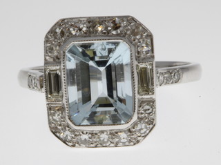 An 18ct white gold aquamarine and diamond cluster ring, the centre stone approx. 2ct surrounded by 0.5ct of diamonds, size O