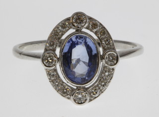 An 18ct white gold sapphire and diamond cluster ring, size O 1/2