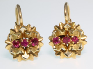 A pair of 18ct gold ruby ear clips, 5 grams