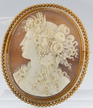 A Victorian gilt metal cameo portrait brooch of a lady 