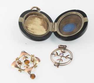 A Victorian carved jet locket and 2 gold gem set pendants