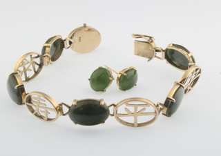 A 14ct gold jade set open plaque bracelet together with a pair of ditto ear studs