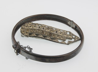 A childs silver bangle and a paste clip