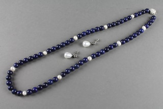 A lapis lazuli and baroque pearl necklace and earrings