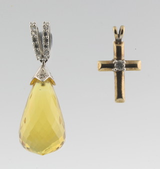 A faceted hardstone pendant and a 9ct gold cross