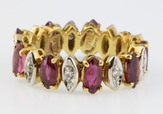An 18ct yellow gold ruby and diamond ring, size L 1/2