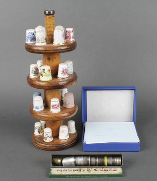 A quantity of collectors thimbles on a 4 tier stand