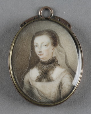 An early 18th Century gold oval clasp containing an oval portrait of a lady 1 1/2" 